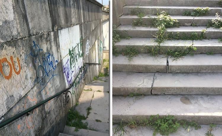 Cimitero: erbacce, muri imbrattati e gradini rotti