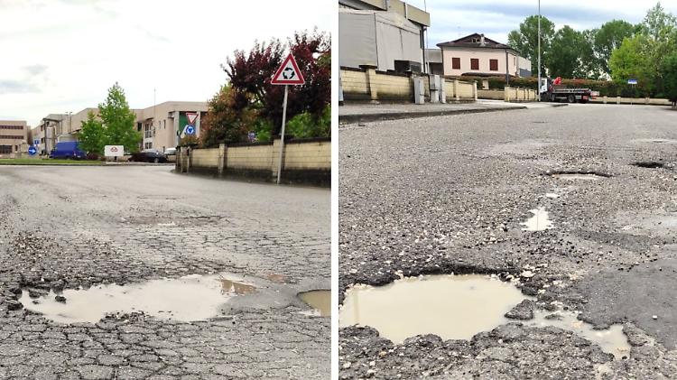 Buche, asfalto falcidiato a Fenilrosso